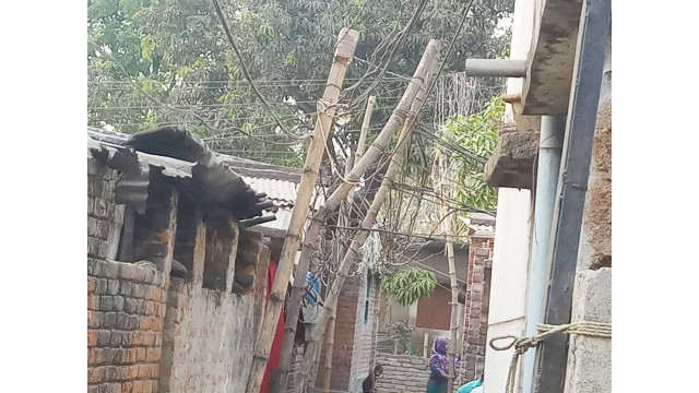 বাঁশের খুঁটিতে বিদ্যুৎ লাইন ঝুঁকিতে গ্রামবাসী